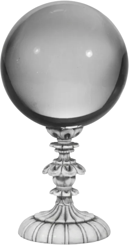 A vintage rock crystal ball resting on a carved pedestal